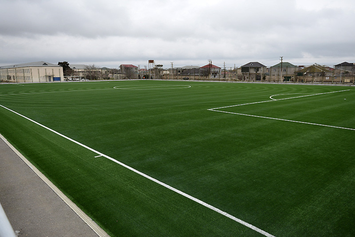 Binə stadionunun ot örtüyü yenilənib - FOTO 