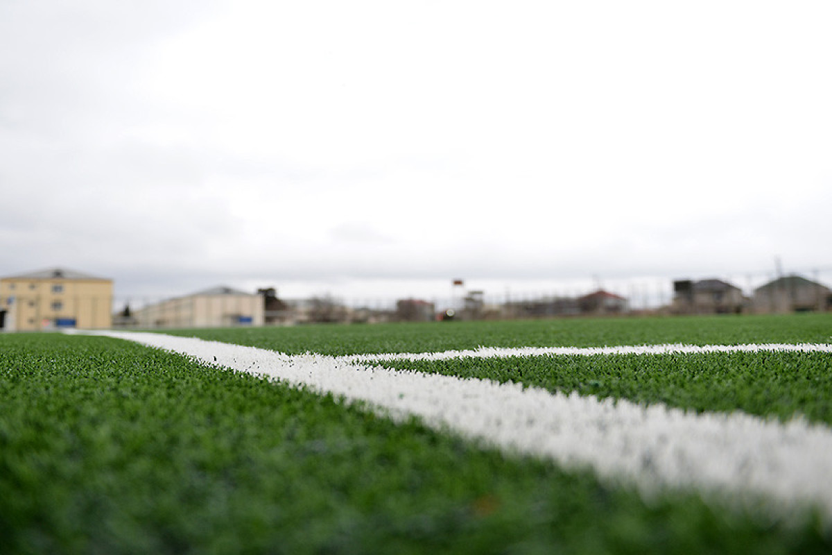 Binə stadionunun ot örtüyü yenilənib - FOTO 